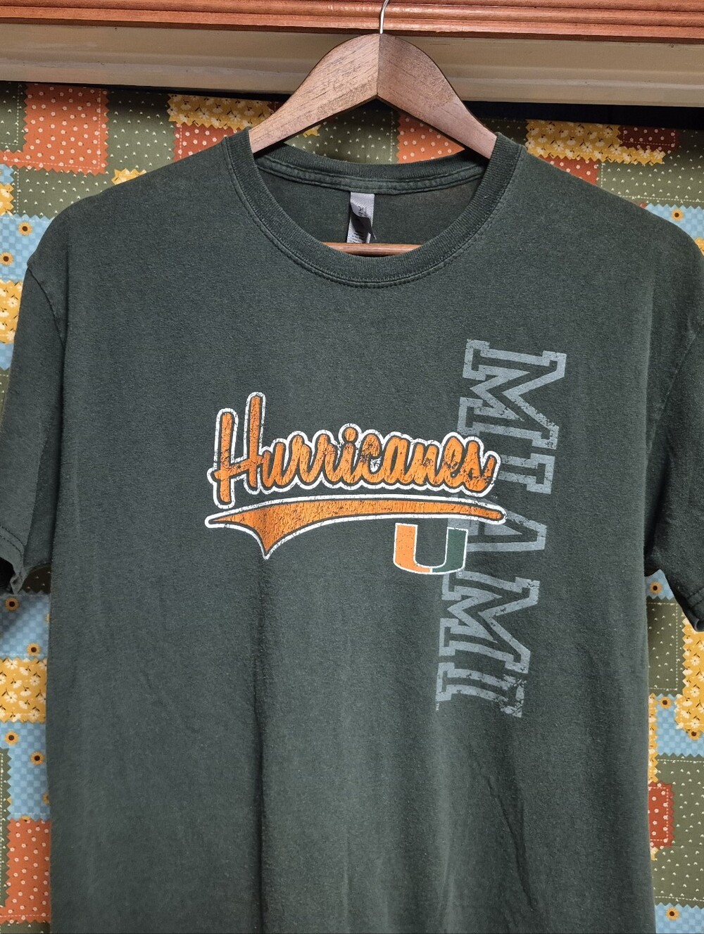 Oura Dark Green Hurricanes Graphic Tee with Orange & White Accents